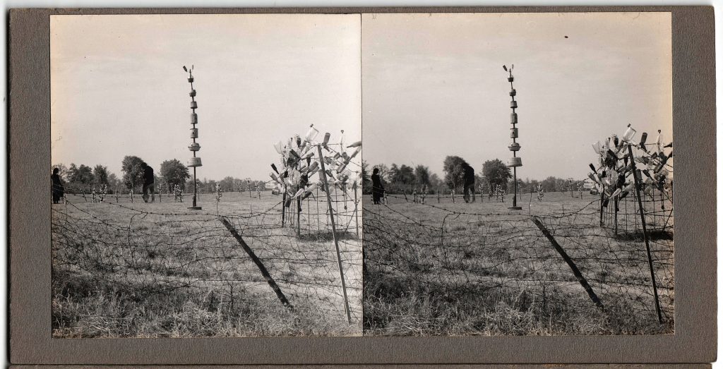 Winter Zero's Bottle Farm, bottle trees and tall sculpture in field, September 27, 1939